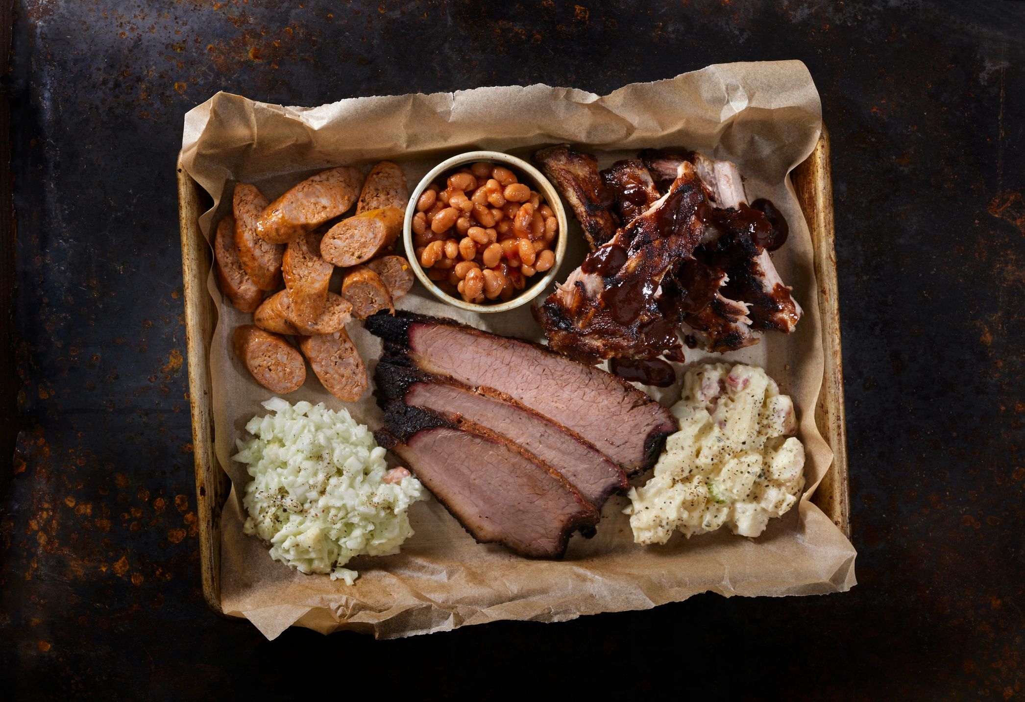 Smoked meats platter with sausage and sides