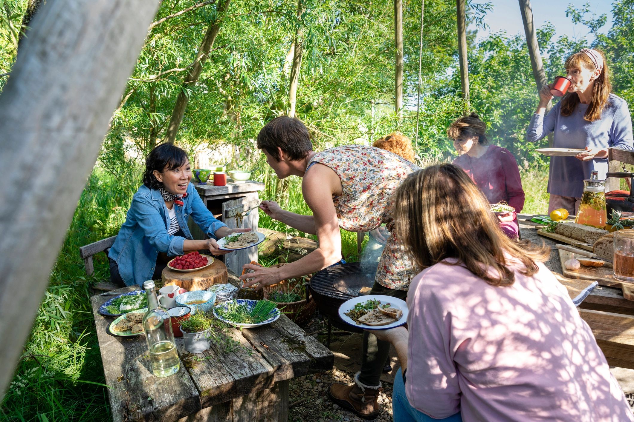Guests sharing food together at an outdoor gathering