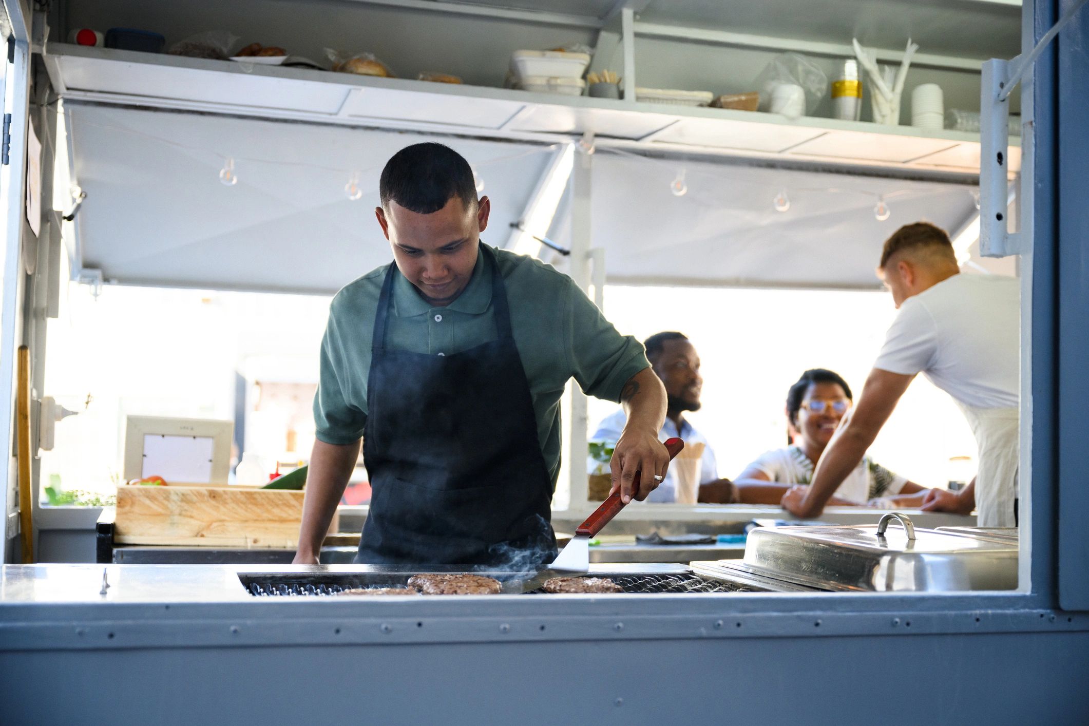 Chef grilling food for a catered gathering